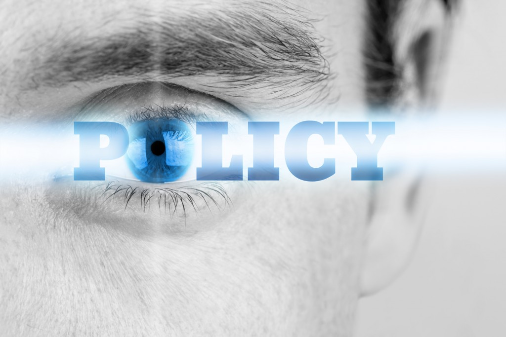 Futuristic image with word Policy using human eye as the letter O.